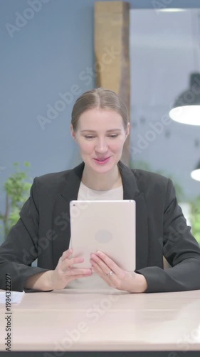 Wallpaper Mural Online Video Chat on Tablet by Businesswoman, Vertical Video Torontodigital.ca