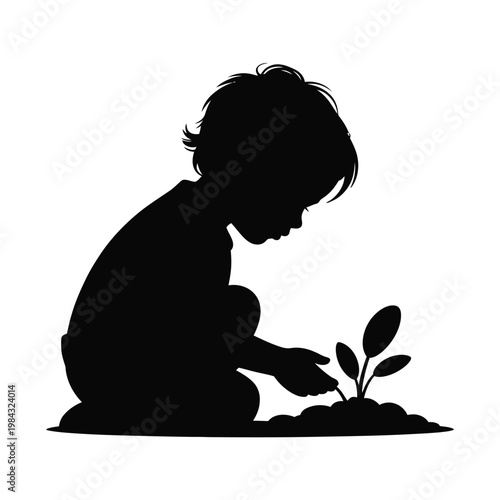A silhouette of a child planting a small green sapling
