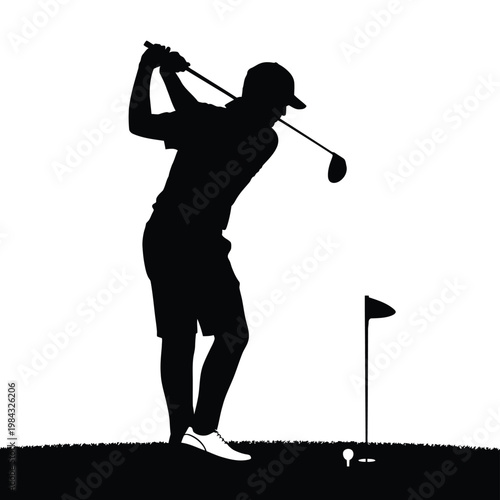 A golfer in silhouette swings his club on the course