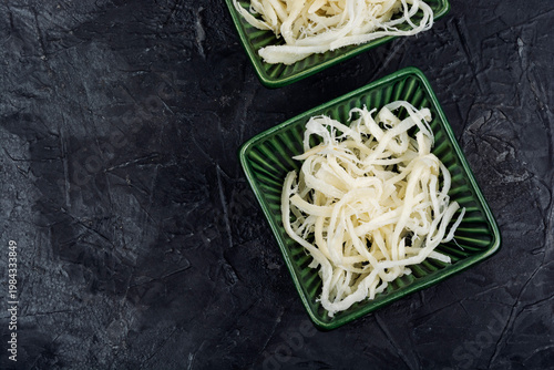 Dried Squid Snack in Bowl on Table, Seafood Concept.