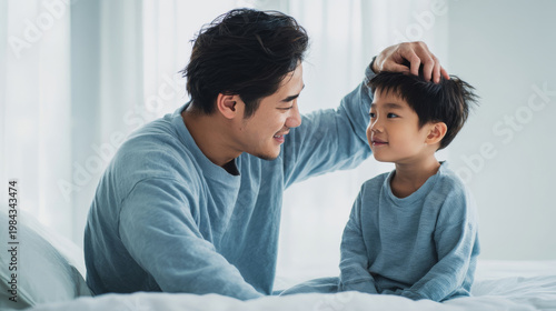 Father and child share joyful moment at home in the morning light with simple gestures and smiles