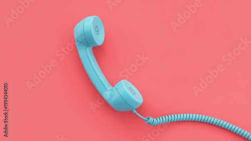Blue retro telephone handset with coiled cord on solid pink background