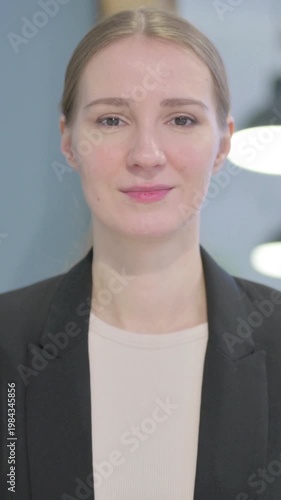 Wallpaper Mural Portrait of Serious Businesswoman Looking at the Camera, Vertical Video Torontodigital.ca