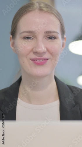 Wallpaper Mural Close Up of Businesswoman Smiling at Camera while using Laptop, Vertical Video Torontodigital.ca