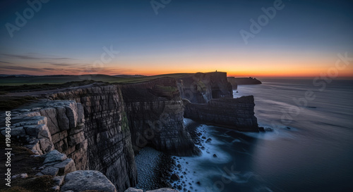 A serene cliffside landscape at sunset overlooking the ocean