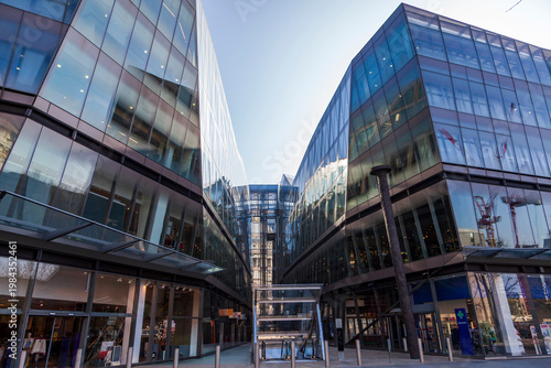 Contemporary glass facade buildings reflecting the urban cityscape of london