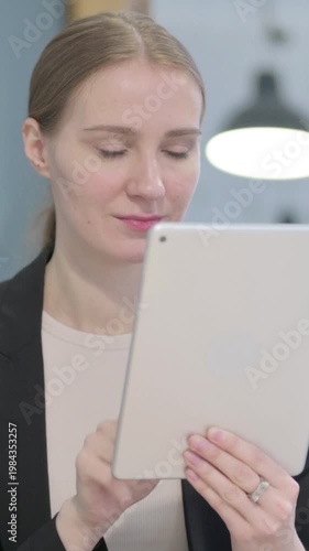 Wallpaper Mural Businesswoman Browsing Internet on Digital Tablet, Vertical Video Torontodigital.ca