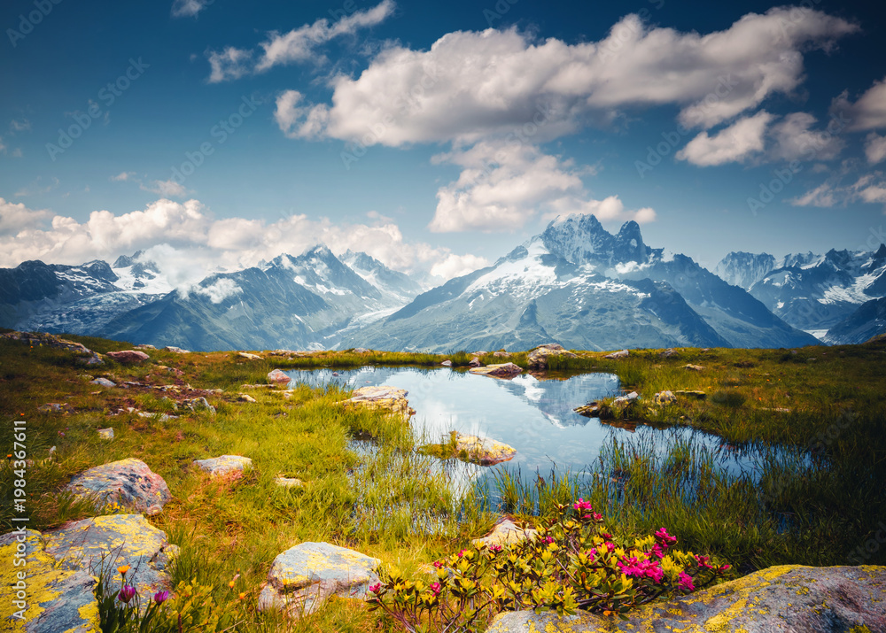 Fototapeta premium Spectacular view of the high-altitude lake Lac Blanc, surrounded by snow-capped mountains. Chamonix resort, France, Europe.