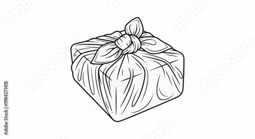 Square package tied with fabric and a decorative knot on top