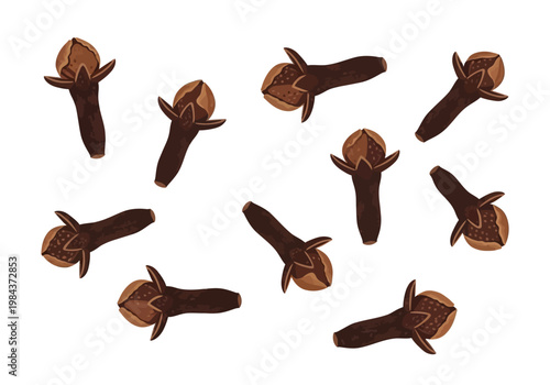 Several cloves are scattered on a surface in a disorganized manner