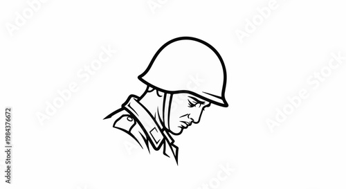 Soldier in helmet, head bowed in contemplation or sadness