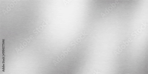 Polished silver stainless steel plate with a brushed metallic texture featuring a shiny gray aluminum surface pattern for a sleek industrial background