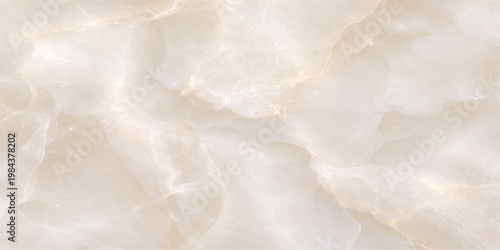 A macro abstract pattern of white wedding rings resting on a smooth cream surface with textures of cold winter snow and light blue sky clouds