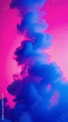Blue ink dissolving in water, creating a beautiful and vibrant abstract cloud against a pink background