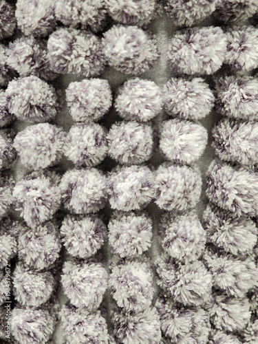 The texture of the carpet is gray. Long pile