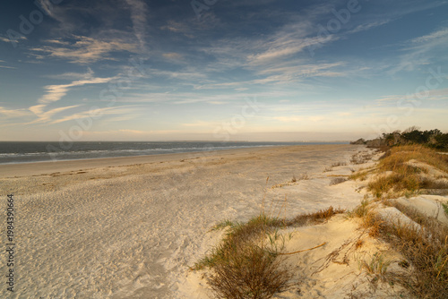 empty beach on Sullivan's Island in warm golden morning light