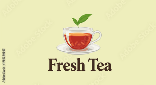 A clear glass cup of amber tea with green leaves sits on a saucer