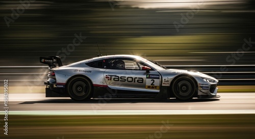 Silver Racing Car Speeding on Track.