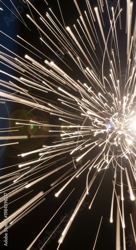 Sparkling Light Burst Against Black Background.