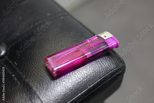 Close-up of a translucent purple disposable lighter