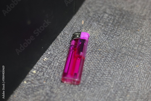 Close-up of a translucent purple disposable lighter