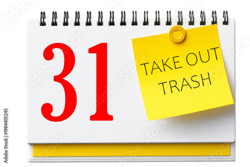 Fényképezés A calendar page with a date of the 31st and an attached yellow note with the text TAKE OUT TRASH