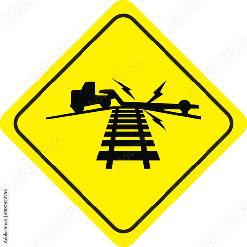 Warning sign for long trailers stuck on railway tracks, Yellow diamond road sign depicting vehicle bottoming out on tracks