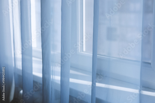 Transparent tulle in a room on a sunny day