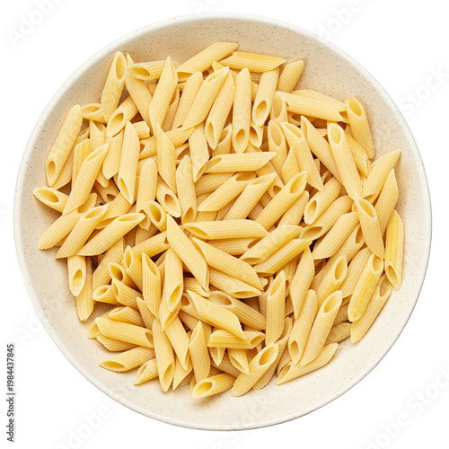 Pennette rigate. Raw pasta in a plate isolated on white background. Top view.