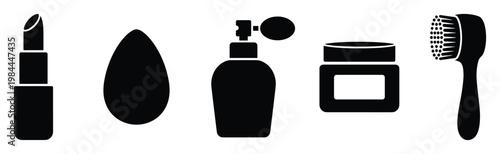 Collection of essential cosmetic and personal hygiene products including lipstick, beauty blender, perfume, cream jar, and cleansing brush for health and grooming applications.