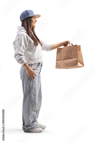 Delivery girl holding a brown paper bag