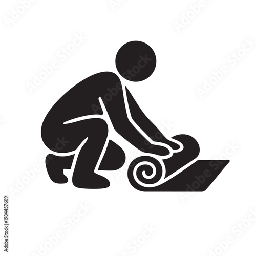 A person rolling out a yoga mat for exercise or a floor workout.