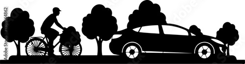 Bicycle rider and car on road with trees.