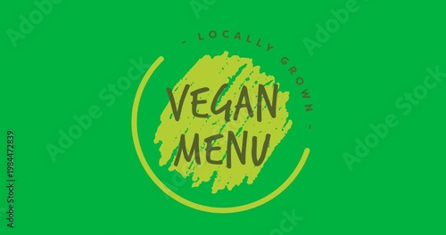 Digital animation of vegan menu text banner against black background