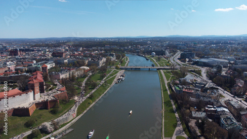 Slika na platnu Cinematic aerial drone panorama of Wawel Castle and the Vistula River in Krakow, Poland, captured on a clear sunny day