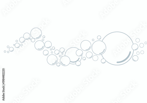 A collection of various sized bubbles floating through the air.