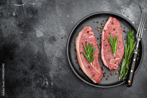 Fotografie Raw picanha beef steaks also known as top sirloin cap and rump cap with rosemary