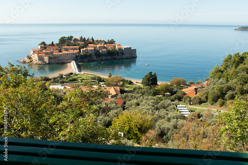 Sveti Stefan island in Montenegro, luxury resort on Adriatic coast, Mediterranean seaside landmark, historic coastal village, scenic travel destination, copy space