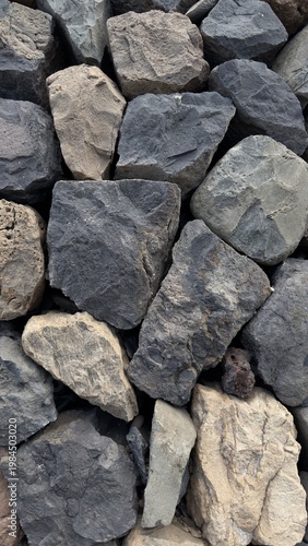 Volcanic stone wall texture background, natural basalt rocks pattern, Tenerife coastal construction