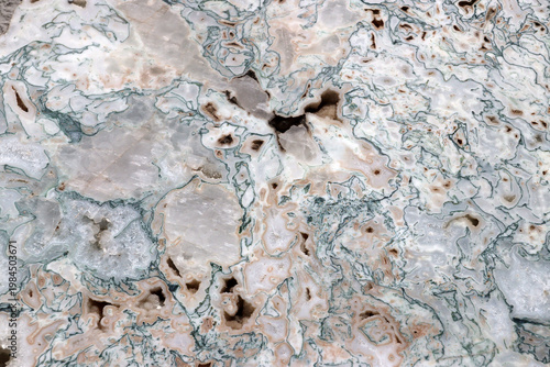 Smooth, cut surface of a Agate quartz geode, white and pink texture background
