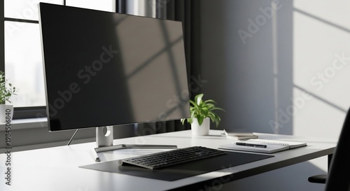 Modern office desk with computer monitor.