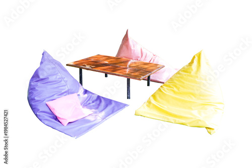 Colorful bean bag seating arrangement soft cushions wooden table isolated on cutout PNG or transparent background. Interior design. Modern lounge furniture representing comfort relaxation casual cafe.