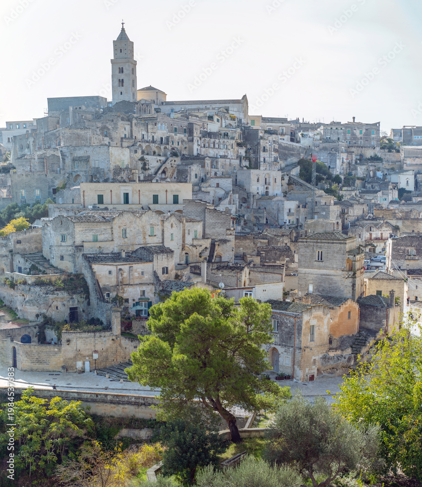 Obraz premium Matera, Italy: Ancient stone buildings and bell tower in Matera