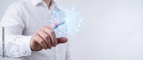 Concept of Digital Security and Protection with a Businessman Interacting with Virtual Shield Graphic