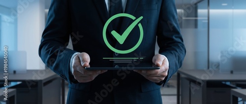 Business Professional Holding Tablet with Check Mark Symbol in Modern Office Environment