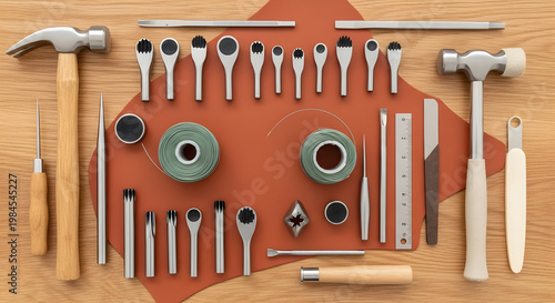 Professional leatherworking tools and equipment set on a wooden workbench for traditional artisan leathercraft and handmade DIY projects.