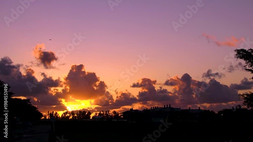Orange Sunrise and clouds on the farm