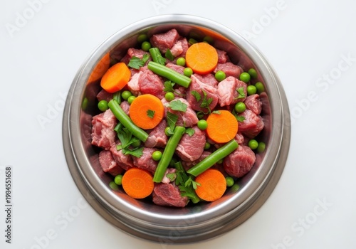 A bowl of raw dog food with vegetables