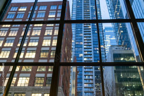 Quadro su tela the view of office blocks from inside an office