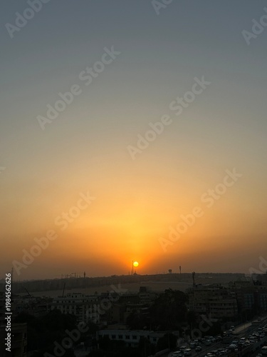 Vibrant Golden Sunset Over Desert Horizon Background